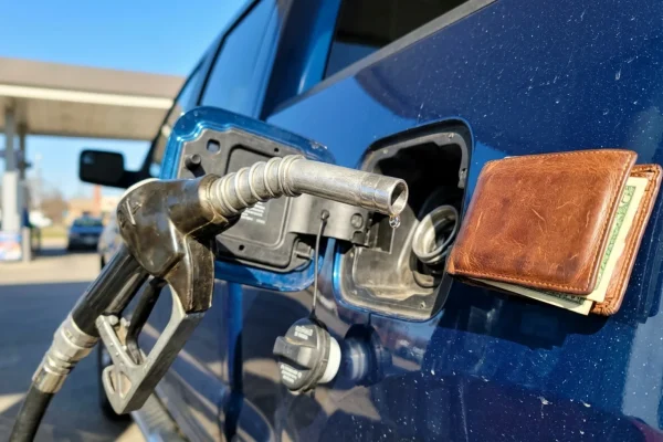 Close-up of a gas pump nozzle at a Canadian gas station.