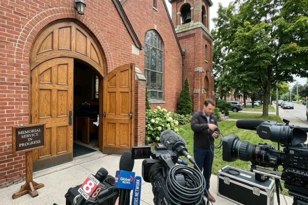 Crowd gathered outside a community church for a highly publicized memorial service.