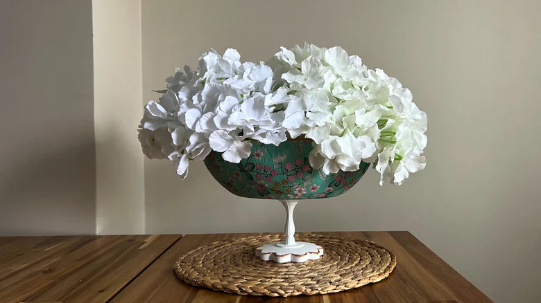 Flower vase made from a decoupaged frying pan and pedestal base
