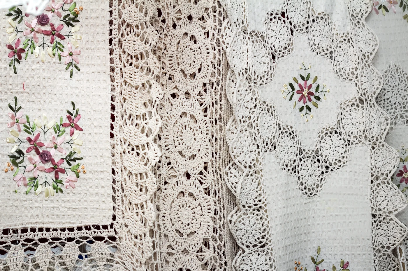 Tablecloths and napkins, decorated with embroidery and lace.