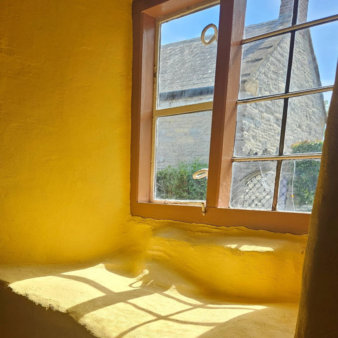 yellow room with brown windows