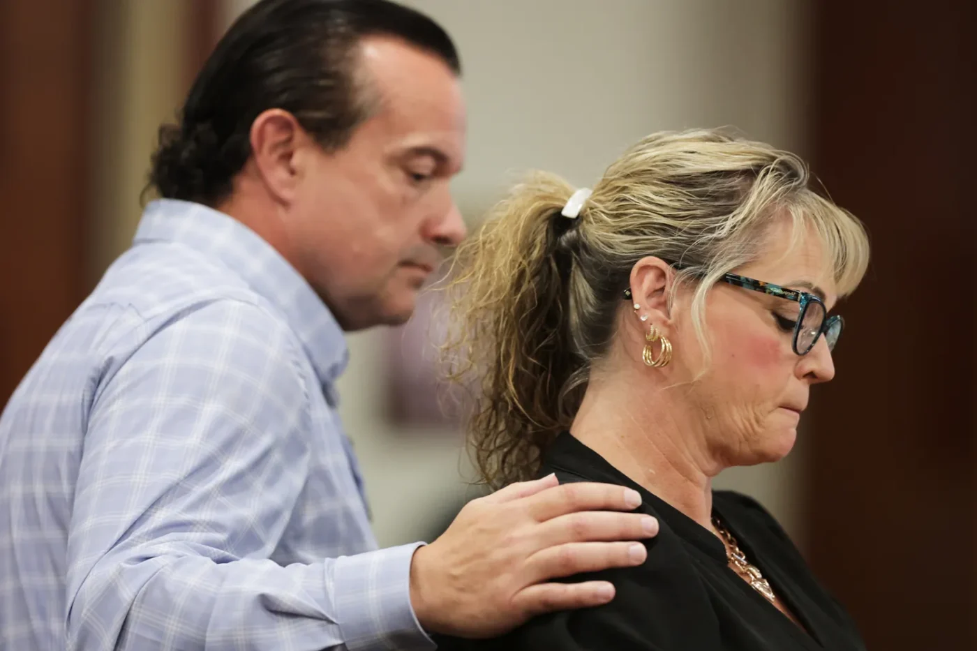 Steve Goncalves consoles Kristi Goncalves as she speaks at the sentencing hearing of Bryan Kohberger at the Ada County Courthouse on July 23, 2025 in Boise, Idaho.